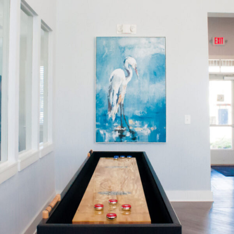 shuffleboard area with painting of a heron