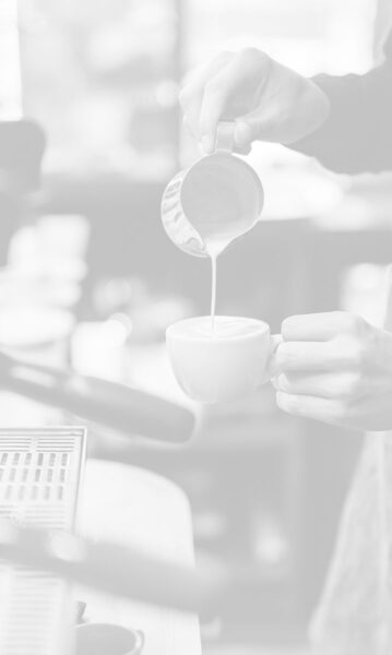 barista making coffee in a shop